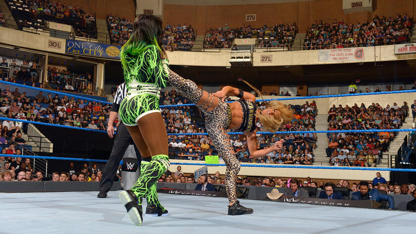 Carmella superkicks Naomi