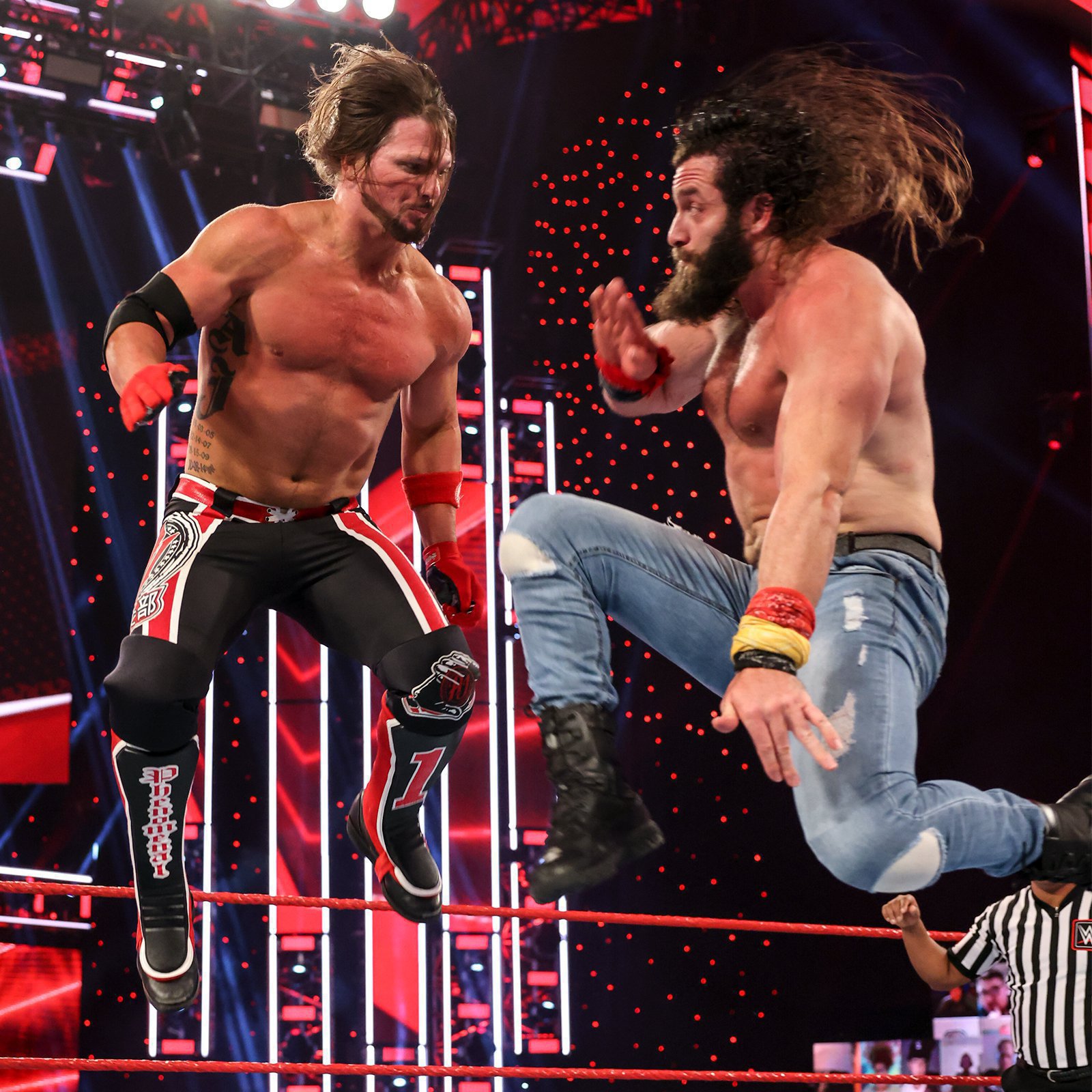 Mid-Air picture of Elias countering AJ Styles' flying attack with a ...