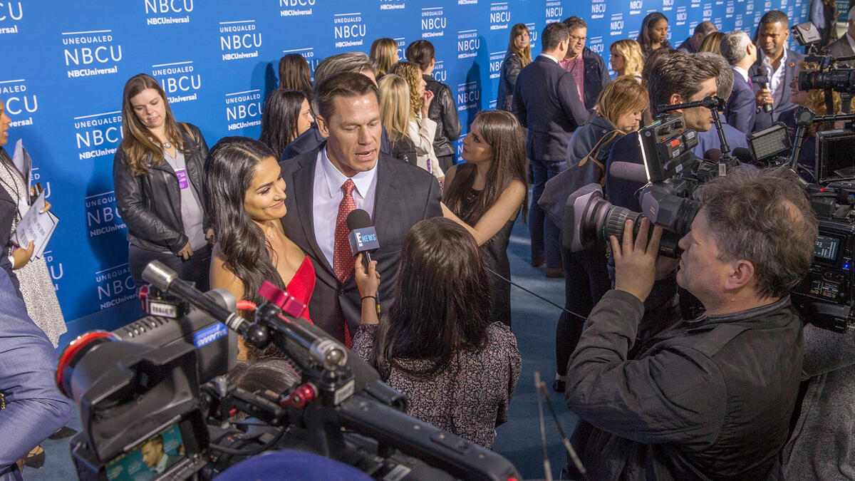 John Cena and Nikki Bella walk the carpet at the 2017 NBCUniversal up