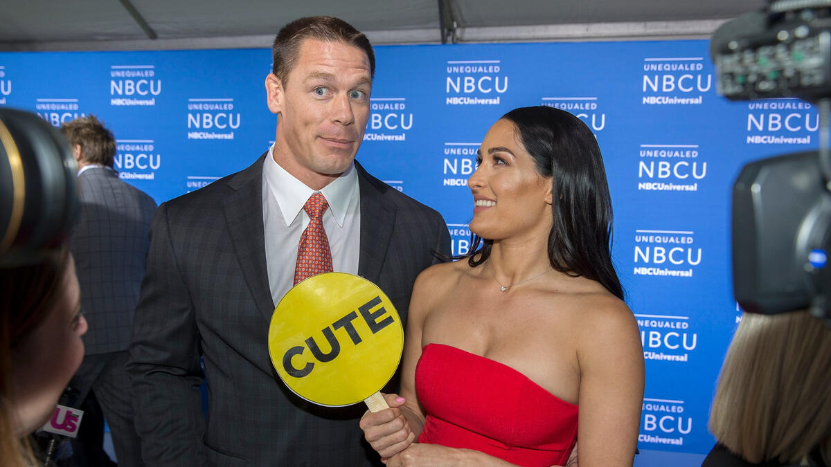 John Cena and Nikki Bella walk the carpet at the 2017 NBCUniversal up