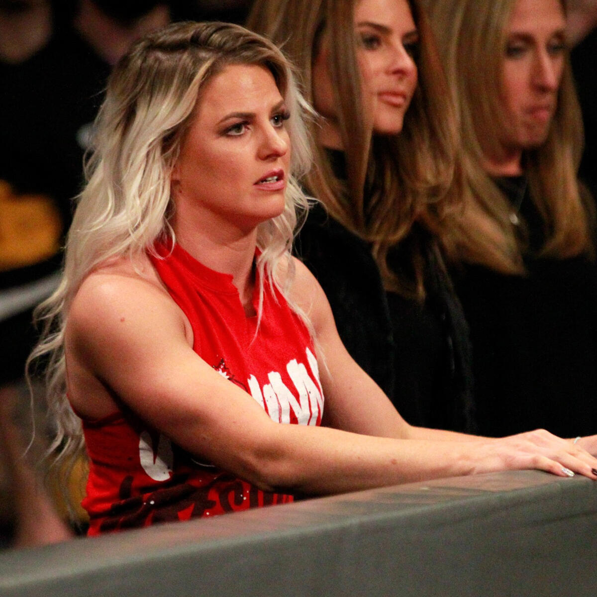 Gargano's wife, newly-signed NXT Superstar Candice LeRae, watches the action from ringside.