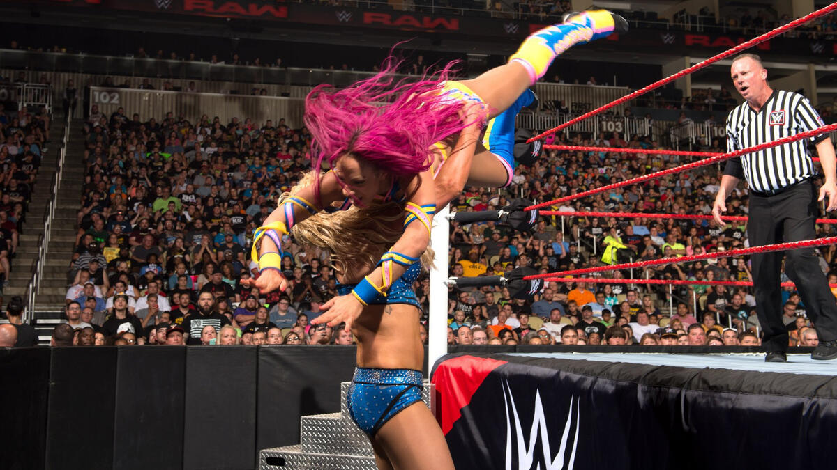 In another entry to their classic rivalry, Sasha Banks won the WWE Women's Championship for the first time, defeating The Queen in a red brand thriller.