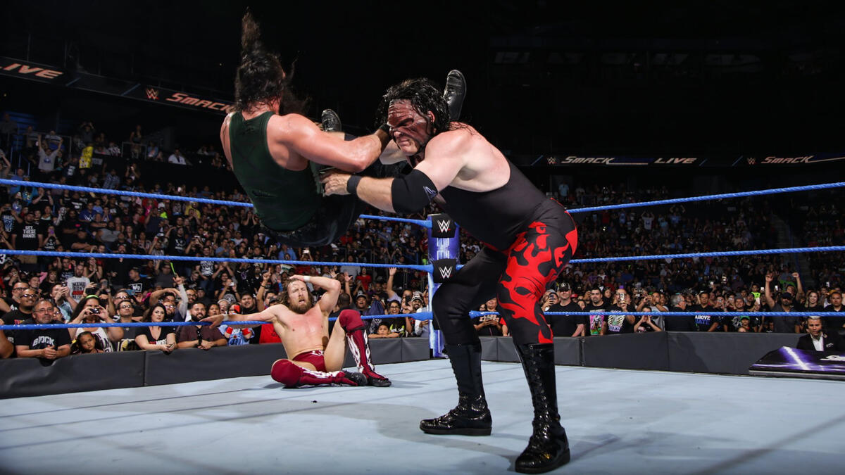 Kane nearly puts Harper through the canvas with a chokeslam!