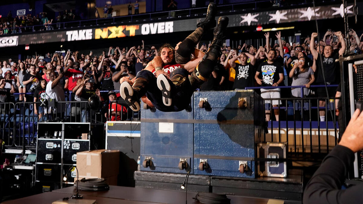 Just as Ciampa did to him last year, Gargano drops his former partner through a pair of tables!