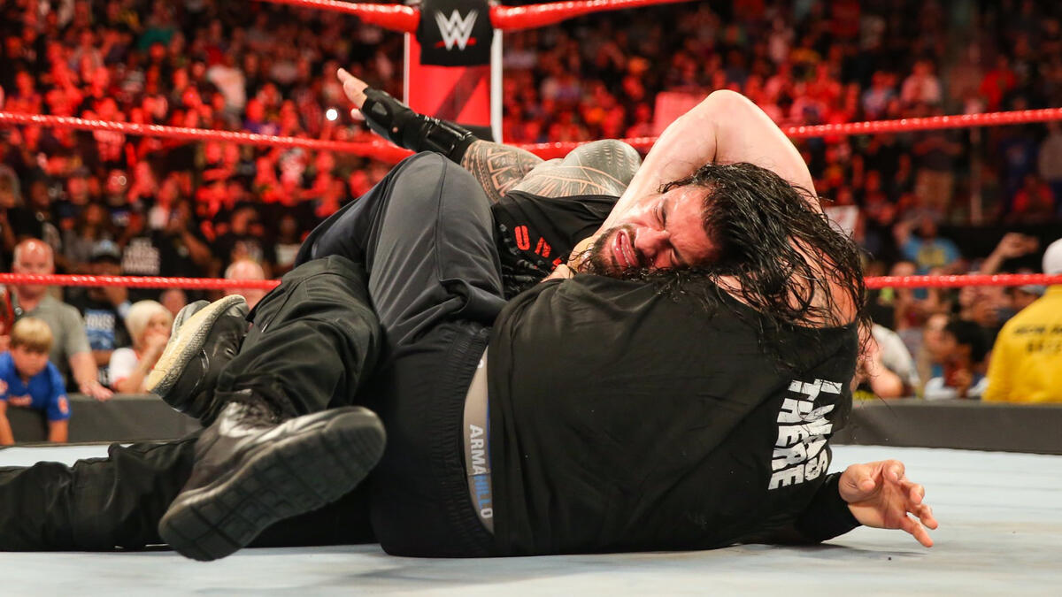 Brock locks Roman in the Guillotine! 