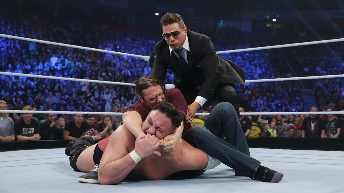 Miz pulls Bryan away.