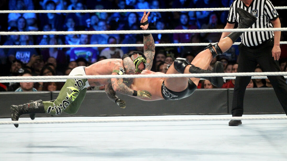 After tossing The Ultimate Underdog back into the ring, The Viper once again levels Mysterio with an RKO for the win!