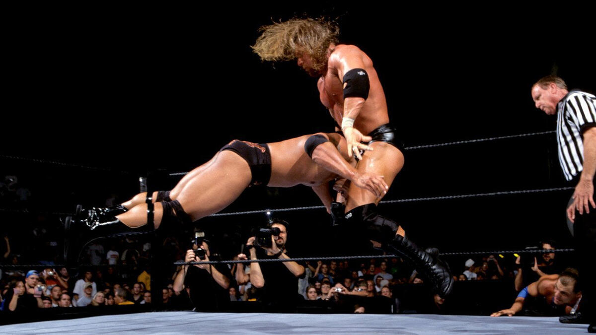 The WWE Championship Triple Threat Match featured Triple H vs. The Rock vs. Kurt Angle.