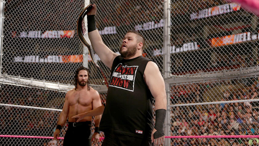 Kevin Owens proudly displays his coveted WWE Universal Championship.