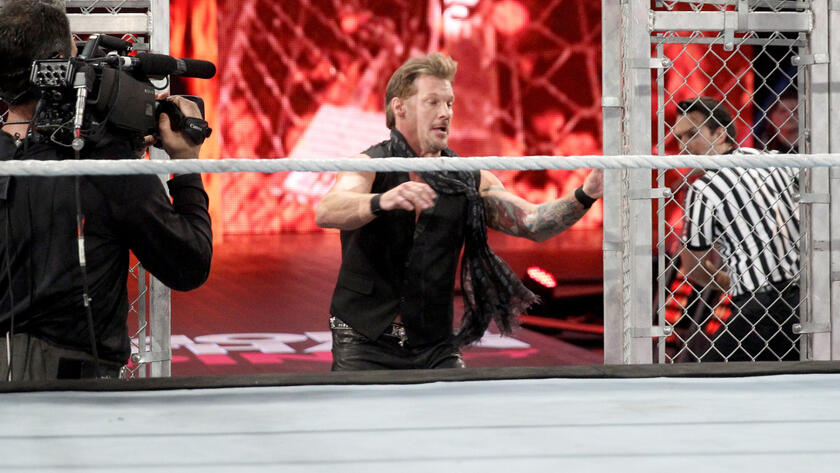 Owens' best friend Chris Jericho takes advantage of the opened Cell door and enters the fray. 