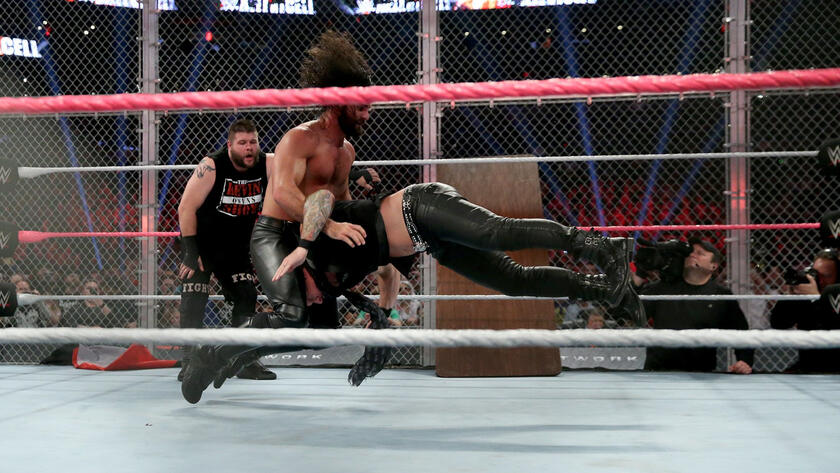 Rollins takes down Jericho with a Pedigree.