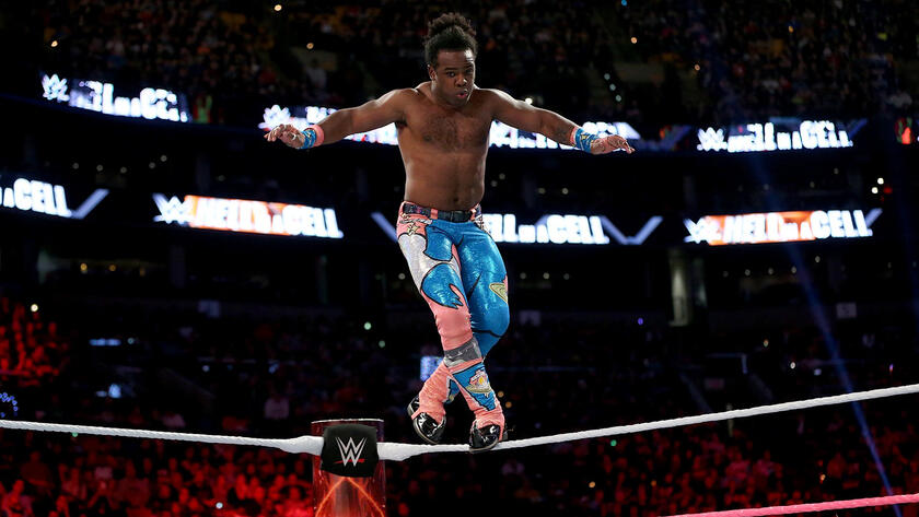Woods shows off his incredible agility and walks across the top rope.