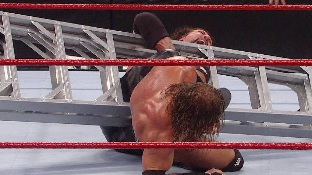 Triple H Uses A Ladder To Help Him Apply The Figure Four On Kevin Nash Wwe Tlc 2011 Wwe 6773