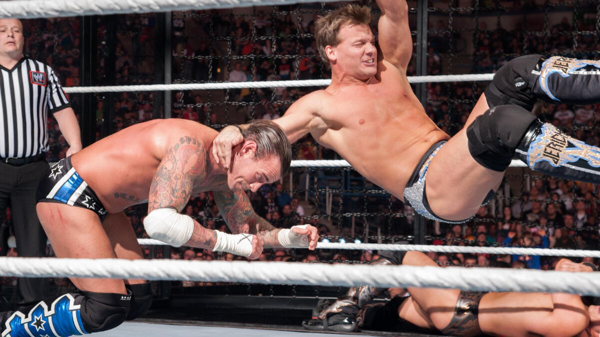 Chris Jericho Slams Cm Punk Into An Elimination Chamber Pod Wwe