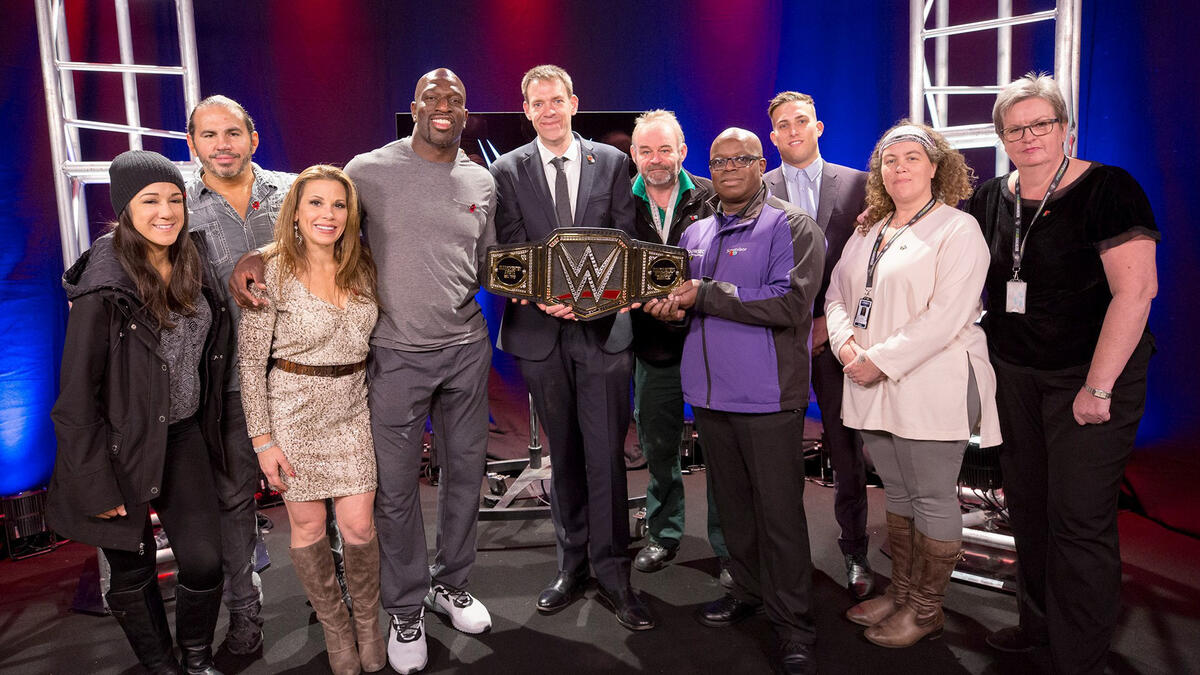 Superstars present custom WWE Championship to Manchester Arena staff