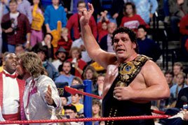 Andre The Giant hands the WWE Title over to The Million Dollar Man.